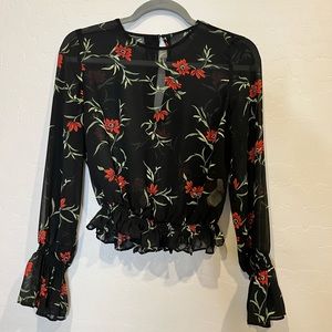 Sheer flower print blouse.